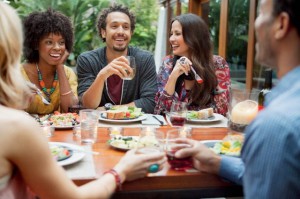Enjoying a meal with friends or family can boost your mood and result in a healthier mind and body than eating alone or in a rush.